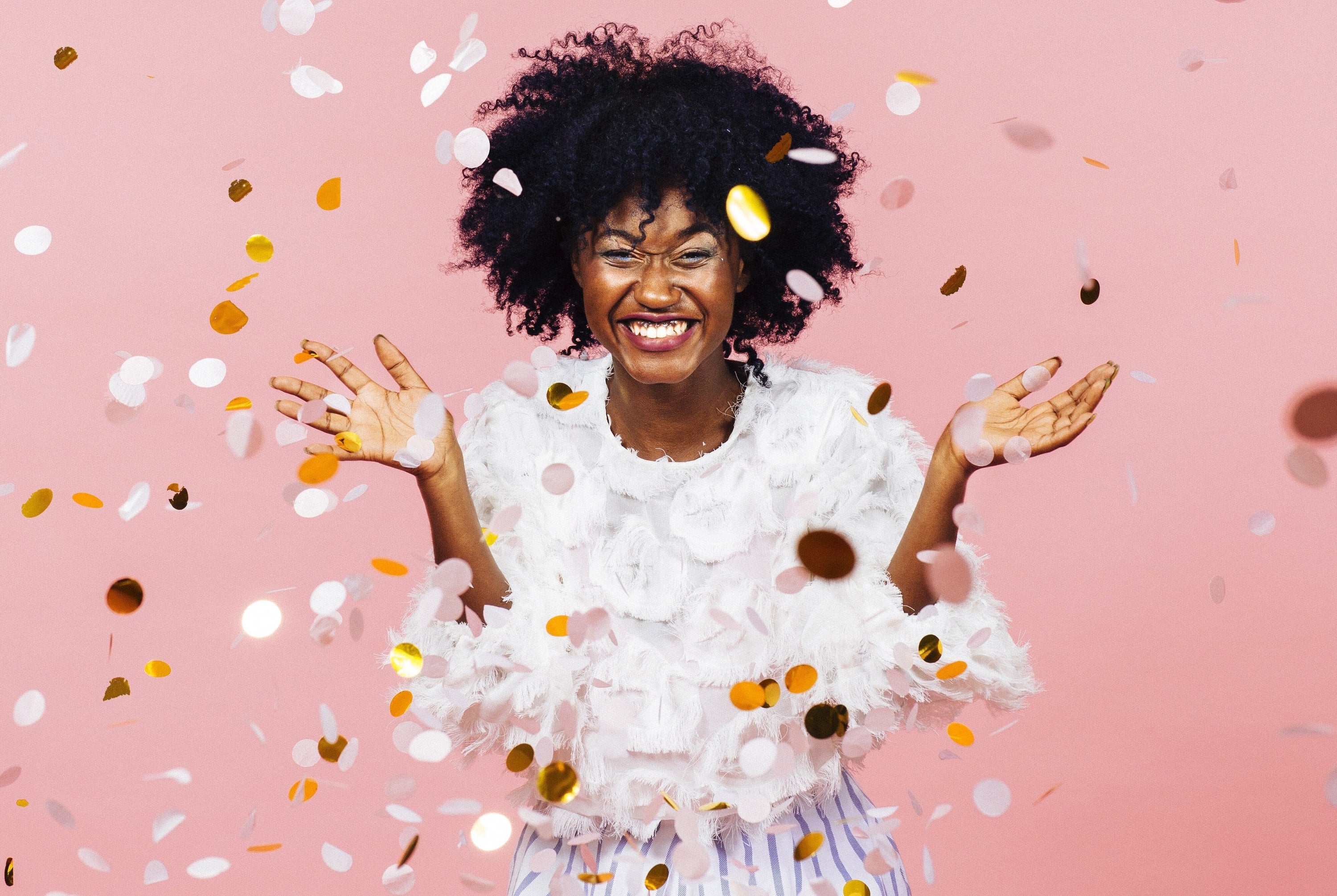 Afro Hair Care Woman Throws Confetti