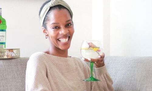 new year natural hair styles Afrocenchix article: light skinned black woman with hair up putting on pink lipstick