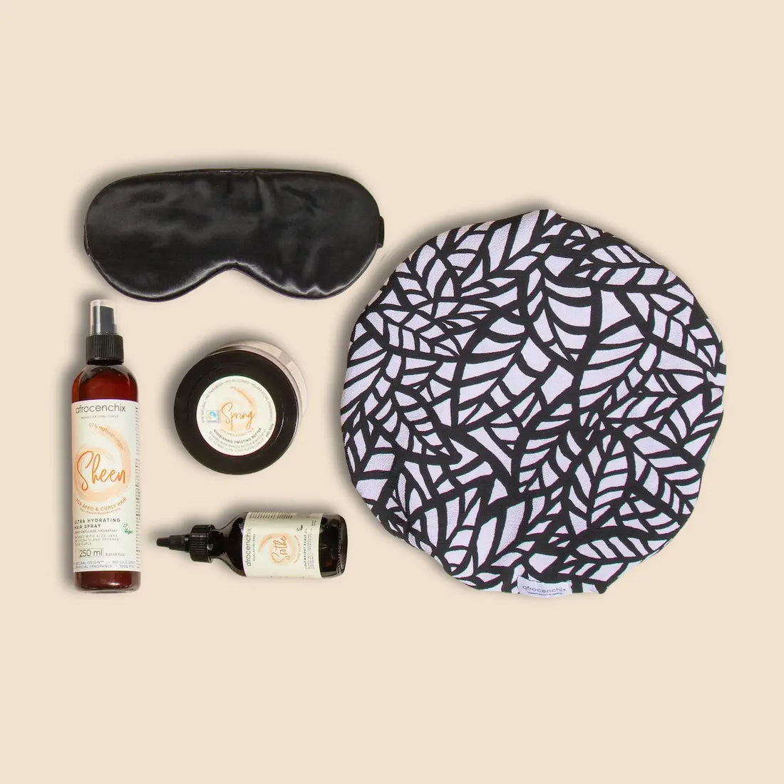 Set of sleep aid products including a sleep mask, earplugs, and a patterned bonnet on a beige background.